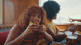 Multiethnic group of friends having meal at 80s vintage diner restaurant - Multicolored young people bonding and having fun, eating in an american fast food burger house	 - Powered by Shutterstock - Get 15% off with code: PIKWIZARD15
