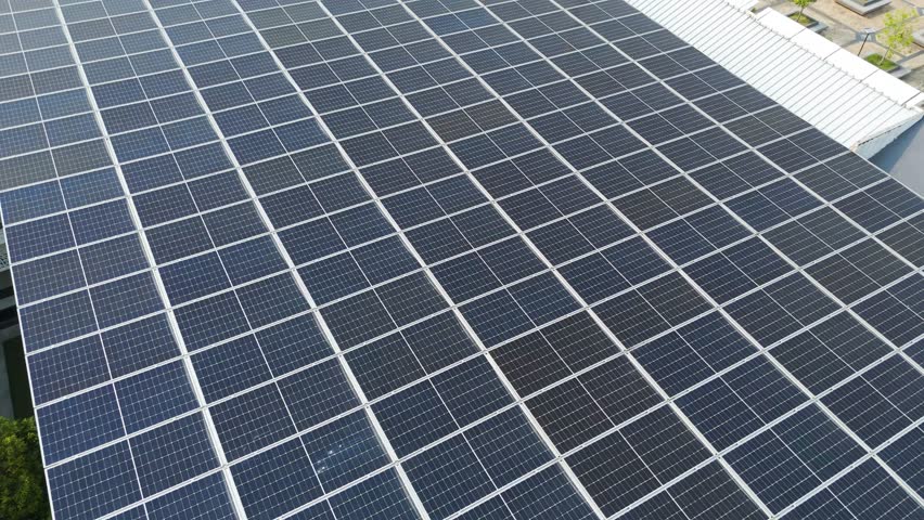 Aerial: solar panels on the rooftop of Raja Haji Fisabilillah Mosque (Cyberjaya Mosque) during the day in Cyberjaya, Sepang, Selangor, Malaysia, flyover drone shot
