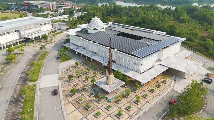 Aerial: Raja Haji Fisabilillah Mosque (Cyberjaya Mosque) with solar panels during the day in Cyberjaya, Sepang, Selangor, Malaysia, orbit drone shot