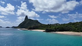 Drone video of Praia do Americano in Noronha with pristine turquoise water, sandy coastline and untouched nature, perfect for travel, tourism and environmental stock footage - Powered by Shutterstock - Get 15% off with code: PIKWIZARD15