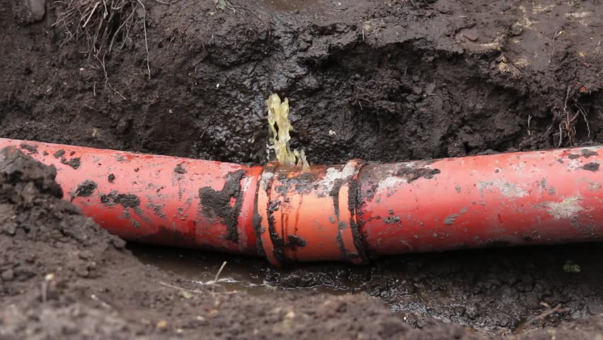 Dramatic Burst Sewer Pipe. Water and Sewage Gushing and Pouring on the Ground. a large volume of water and sewerage pouring out of a broken line, creating a chaotic scene on the ground outside.