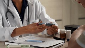 Medical consultation for diabetes. Doctor explains insulin pen injection to diabetic patient. Diabetes treatment, healthcare education, and chronic disease management - Powered by Shutterstock - Get 15% off with code: PIKWIZARD15