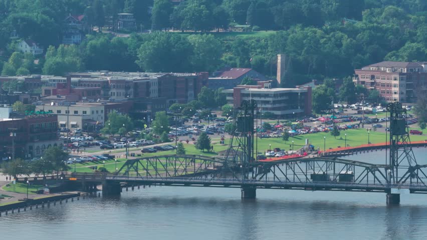 Telephoto panning aerial shot of the lift bridge over the St. Croix River in Stillwater, Minnesota. 4K