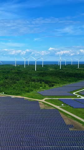 Renewable energy electricity wind turbine large scale solar farm photovoltaic panels aerial vertical