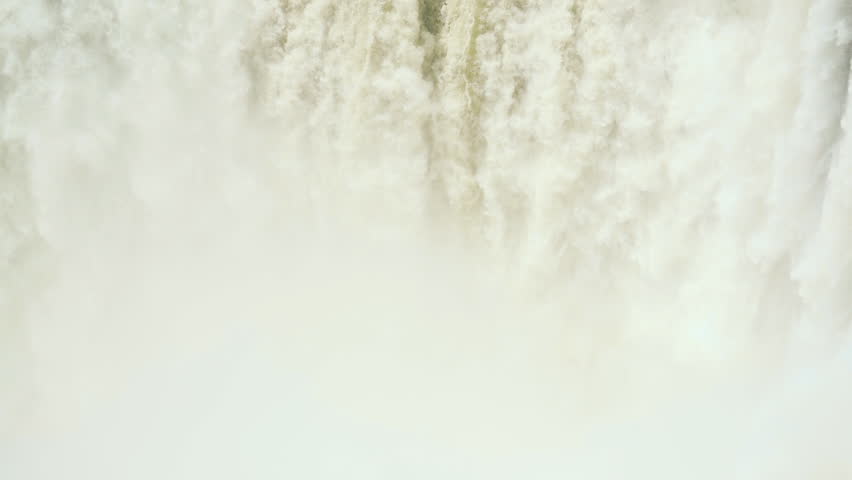 Slow-motion close-up of Devil’s Throat with upward tilt — Iguazú Falls, Argentina