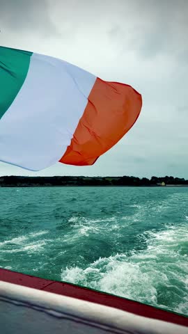boat on the ocean with irish flag
