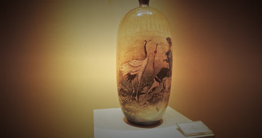 chinese vase showcasing detailed imagery of cranes, symbolizing peace, beauty, and artistry in design. from the Ming and Qing dynasties.