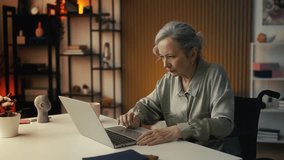 Sad senior woman in wheelchair reading news email about hospital expenses - Powered by Shutterstock - Get 15% off with code: PIKWIZARD15