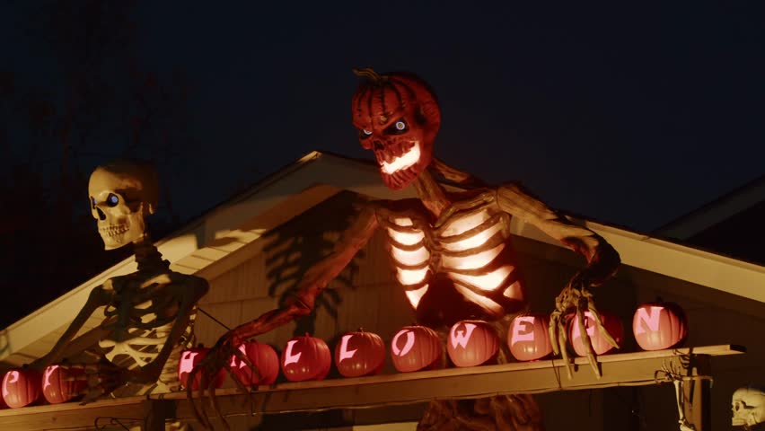 Halloween Skeletons Hang From The Roof, Monsters Guard The Doorstep, And Dozens Of Pumpkins Glow At Night As The Village House Becomes A Haunted Mansion For Halloween Near Halifax.