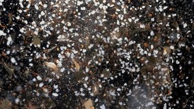 Scattering of various coarsely ground granulated spices on a black background in macro. Slow motion - Powered by Shutterstock - Get 15% off with code: PIKWIZARD15