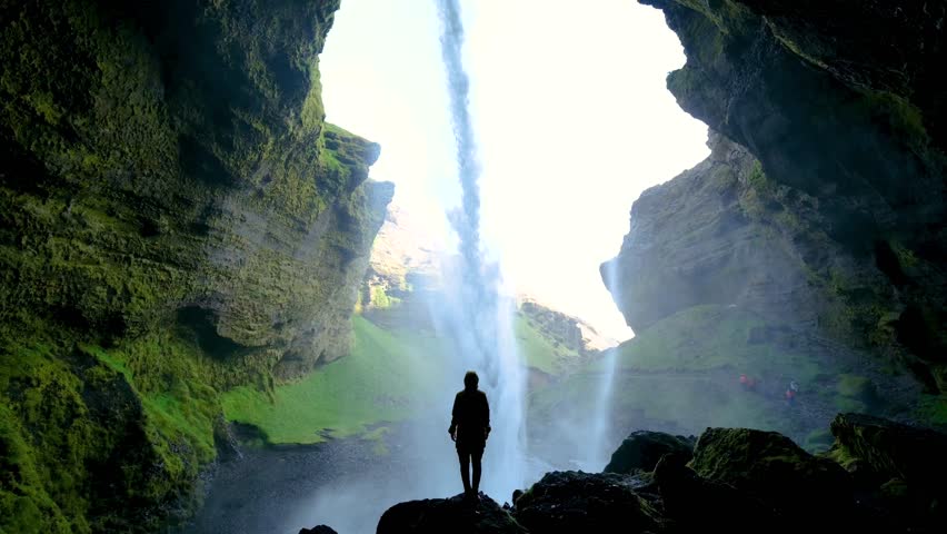 Explore the stunning Kvernufoss waterfall in Iceland, where cascading water flows through a dramatic cliffside cavern.