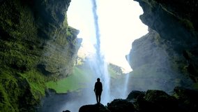 Explore the stunning Kvernufoss waterfall in Iceland, where cascading water flows through a dramatic cliffside cavern. - Powered by Shutterstock - Get 15% off with code: PIKWIZARD15