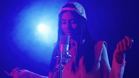 Young singer performing live in slow motion - Powered by Shutterstock - Get 15% off with code: PIKWIZARD15