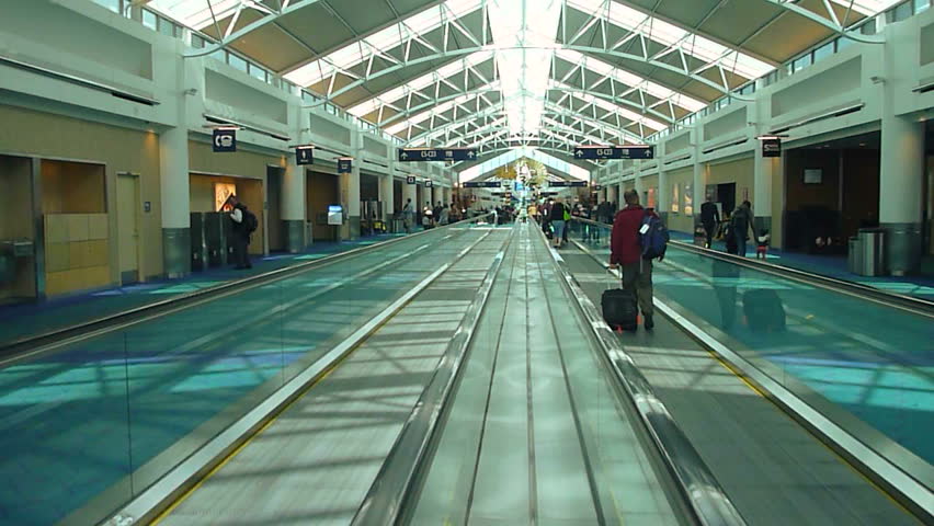 PORTLAND, OREGON AIRPORT - CIRCA 2013: Many people traveling to their gate in