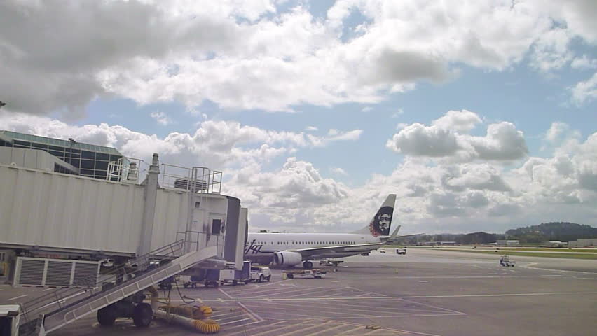 PORTLAND, OREGON AIRPORT - CIRCA 2013: Airplane parked at gate in Portland,