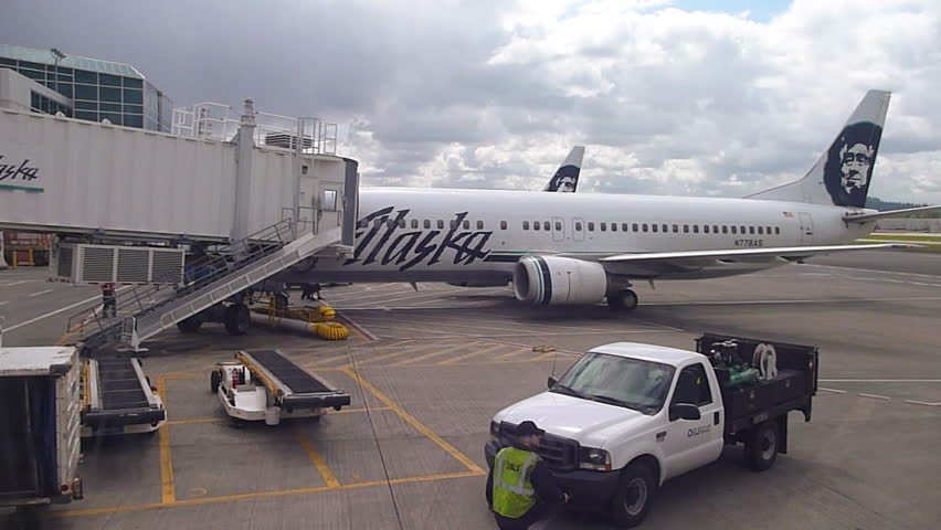 PORTLAND, OREGON AIRPORT - CIRCA 2013: Airplane parked at gate in Portland,
