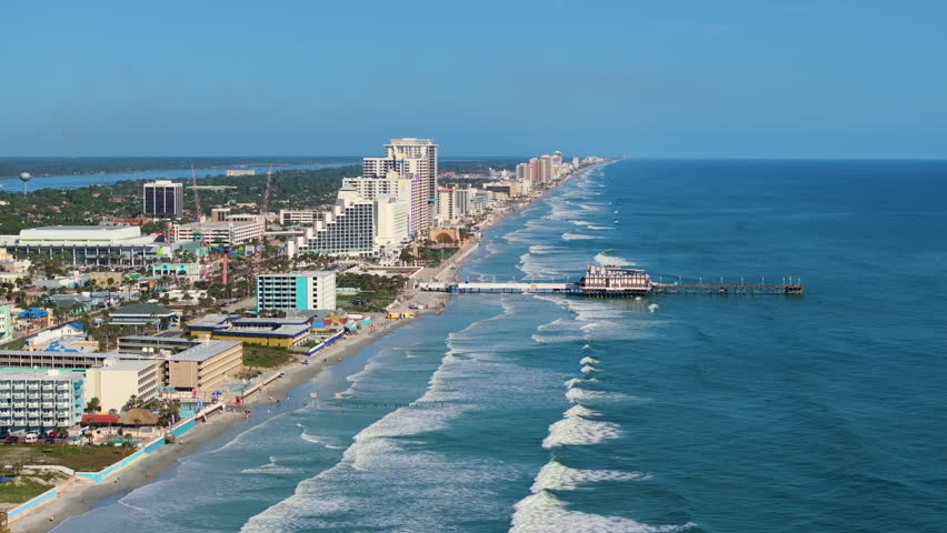 Main Street Pier in Daytona Beach, Florida. American Atlantic coast location with active tourist development and beachfront urban planning.