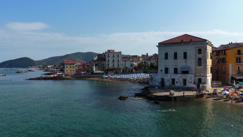 The seafront of Santa Maria di Castellabate, a tourist destination in southern Italy.
Aerial view of the beach and the seaside village of Cilento. 4K
