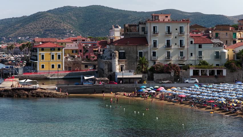 The seafront of Santa Maria di Castellabate, a tourist destination in southern Italy.
Aerial view of the beach and the seaside village of Cilento. 4K