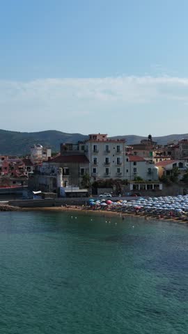 The seafront of Santa Maria di Castellabate, a tourist destination in southern Italy.
Aerial view of the beach and the seaside village of Cilento. 4K