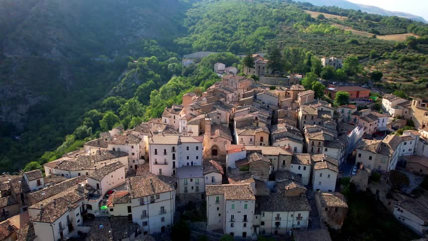 Italy Abruzzo tourism . most beautiful medieval villages - Anversa degli Abruzzi in National park surrounded by Apennine mountains. aerial drone 4k hd footage