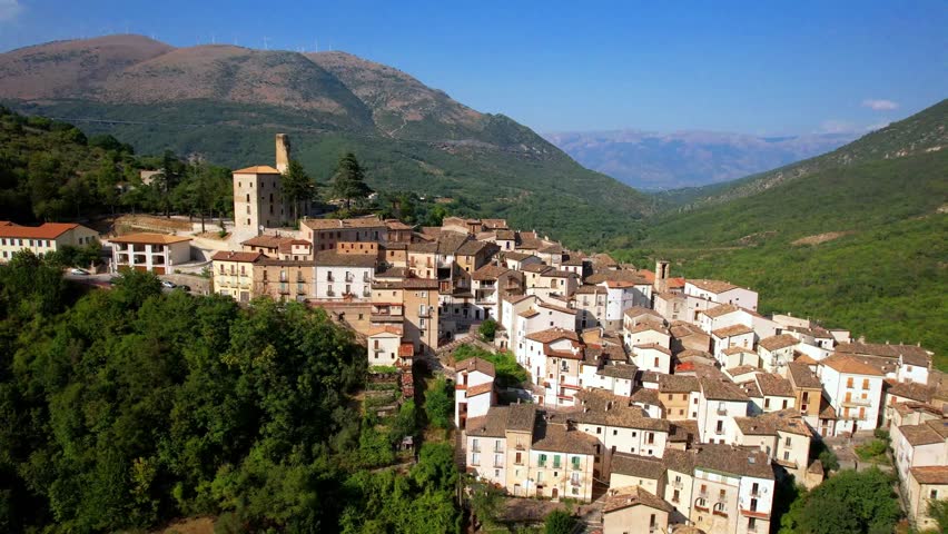 Italy Abruzzo tourism . most beautiful medieval villages - Anversa degli Abruzzi in National park surrounded by Apennine mountains. aerial drone 4k hd footage