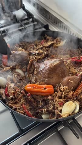 Bell peppers, white onions, shiitake mushrooms, see yao sauce, and rice are cooked together in a pan, creating a flavorful base for the see yao duck dish. This stir-fry process blends fresh ingredient