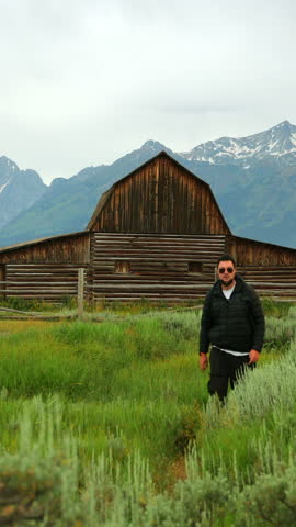 Explore the stunning landscapes of Grand Teton National Park in Wyoming, featuring majestic mountains, lush greenery, and charming historical barns that showcase natures splendor