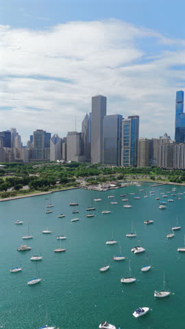 Cinematic and breathtaking Chicago Illinois skyline and its vibrant style, lively waterfront from an elevated sky view. Perfect for both travel enthusiasts and city lovers alike