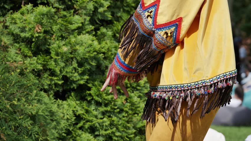Indigenous dancer wearing traditional clothing during Latin American festival