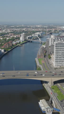 Vertical establishing aerial view of Glasgow, city in Scotland, United Kingdom on bright, sunny day.
