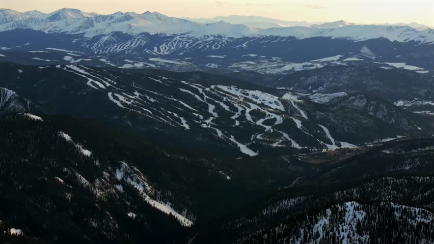 Winter Spring Keystone Breckenridge Ski Resort sunset golden hour Loveland Pass Colorado aerial drone Continental Divide Rocky Mountains ski trail runs Quandary Peak Boreas Pass forward pan up motion