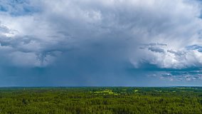 Cumulonimbus cloud thundercloud with rain falling from its base timelapse forest nature - Powered by Shutterstock - Get 15% off with code: PIKWIZARD15