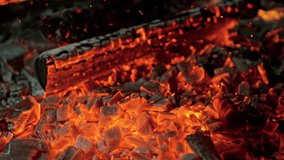 Super Slow Motion of Burning Wood Falling Into Glowing Embers, and Sparks in 1000fps. - Powered by Shutterstock - Get 15% off with code: PIKWIZARD15