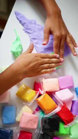 Engaging kids in a vibrant clay modeling session with creative colors and fun shapes to express their imagination