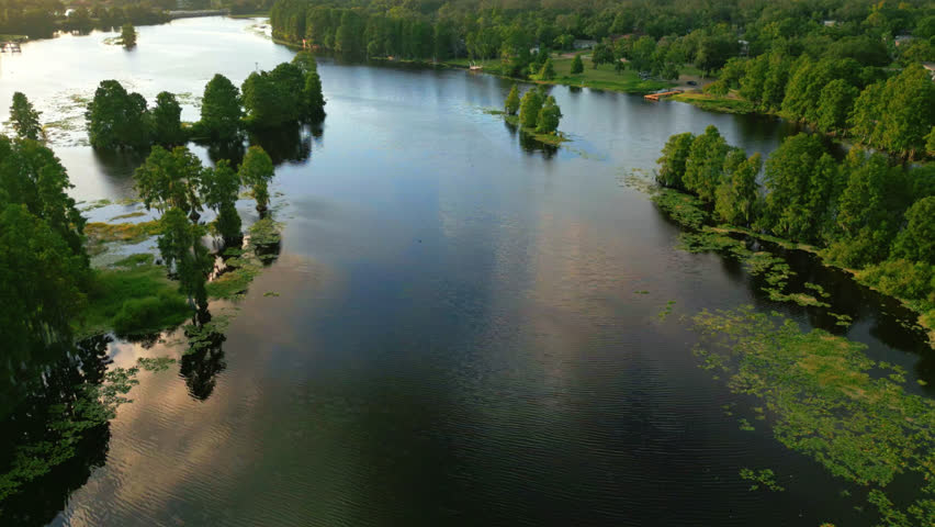 Sunny Reflections Over Serene River With Trees and Small Islands In Tampa, Florida, United States. Aerial Drone Shot