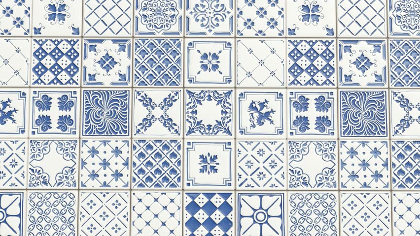 Patchwork of blue and white decorative ceramic tile patterns.