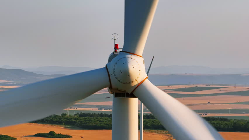 Wind turbine rotor close-up drone shot in Vetren Park Suvorovo Bulgaria demonstrating renewable green energy, electricity generation, sustainable resources, countryside farming fields eco technology