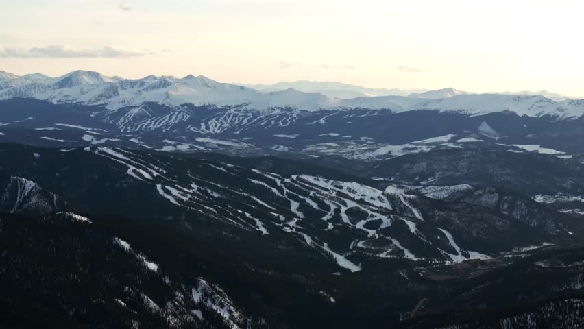 Keystone Breckenridge Ski Resort sunset golden hour Loveland Pass Colorado aerial drone Winter Spring Continental Divide Rocky Mountains ski trail runs Quandary Peak Boreas Pass circle right motion