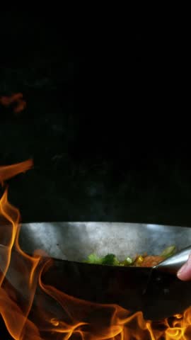 Super Slow Motion of Flying Asian Wok Ingredients . Filmed on High Speed Cinema Camera at 1000 FPS