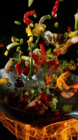 Super Slow Motion of Flying Asian Wok Ingredients . Filmed on High Speed Cinema Camera at 1000 FPS