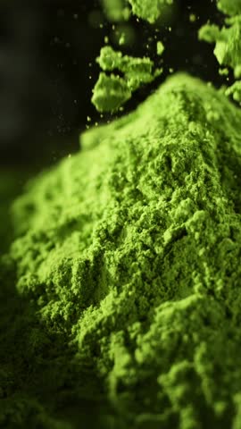 Super Slow Motion Detail Shot of Sprinkling Matcha Powder . Filmed on High Speed Cinematic Camera at 1000 FPS