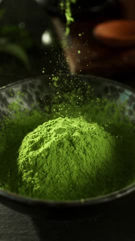 Super Slow Motion Detail Shot of Sprinkling Matcha Powder . Filmed on High Speed Cinematic Camera at 1000 FPS
