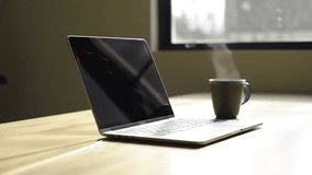 Modern Minimalist Workspace with Laptop and Coffee in Natural Light 4K Stock Footage - Powered by Shutterstock - Get 15% off with code: PIKWIZARD15