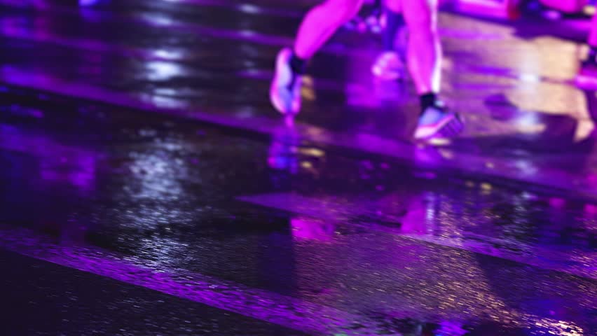 Night marathon runners crowd, sportsmen participants start running the half-marathon in the night city streets, crowd of sportswomen joggers in motion, group athletes outdoor training competition 