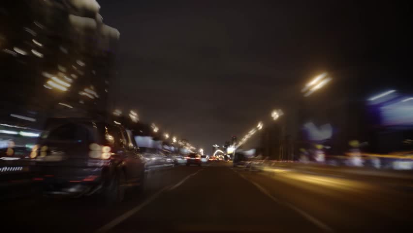 Fast cars driving on highway at night, montage