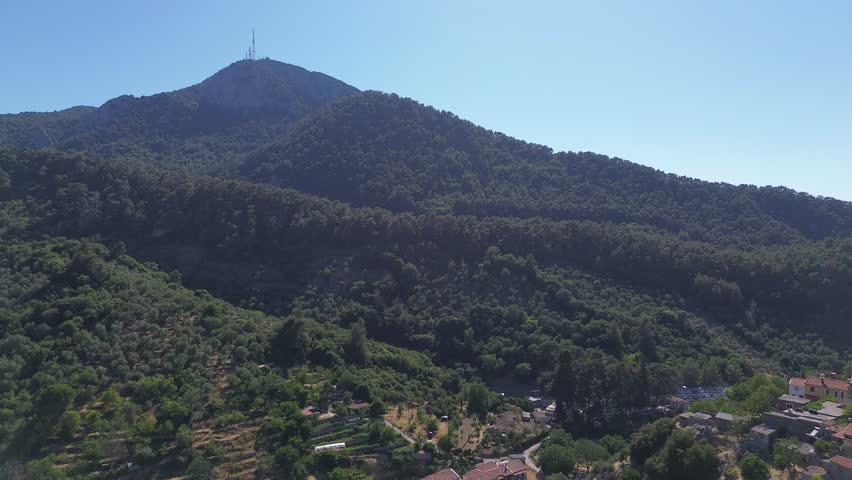 Agiasos, Island Lesvos, Greece - July 14th, 2025 - footage of the mountain village, traditional architecture, roofs, streets, temples, green forest, slopes and panoramic views