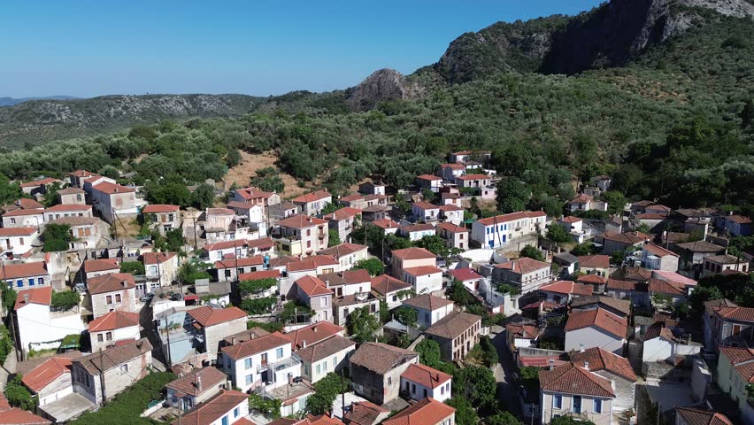 Asomatos, Island Lesvos, Greece - July 14th, 2025 - footage of the mountain village, traditional architecture, roofs, streets, temples, green forest, slopes and panoramic views
