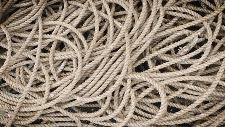 Boat mooring rope heap panning motion background stock footage