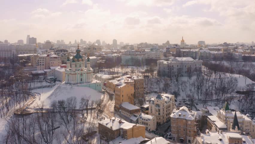 Aerial panoramic landscape of beautiful city buildings and the church. Winter in Kyiv.